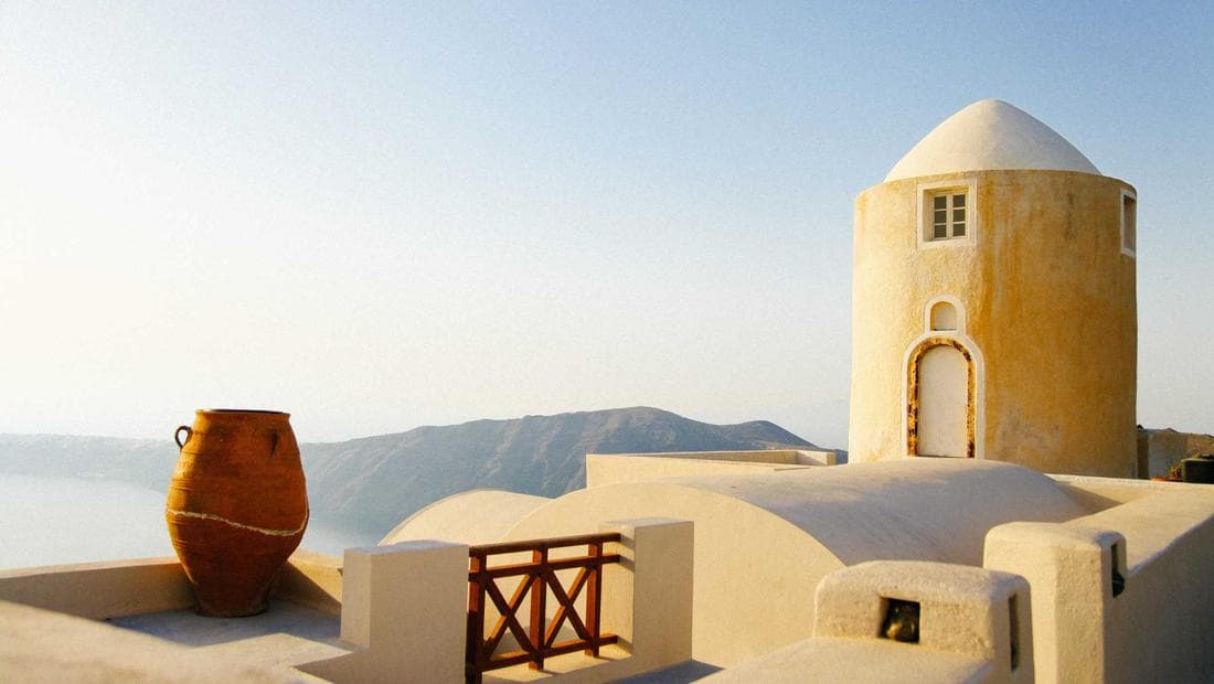 Manhattan island seen from directly above, towers casting long shadows across a grid of streets